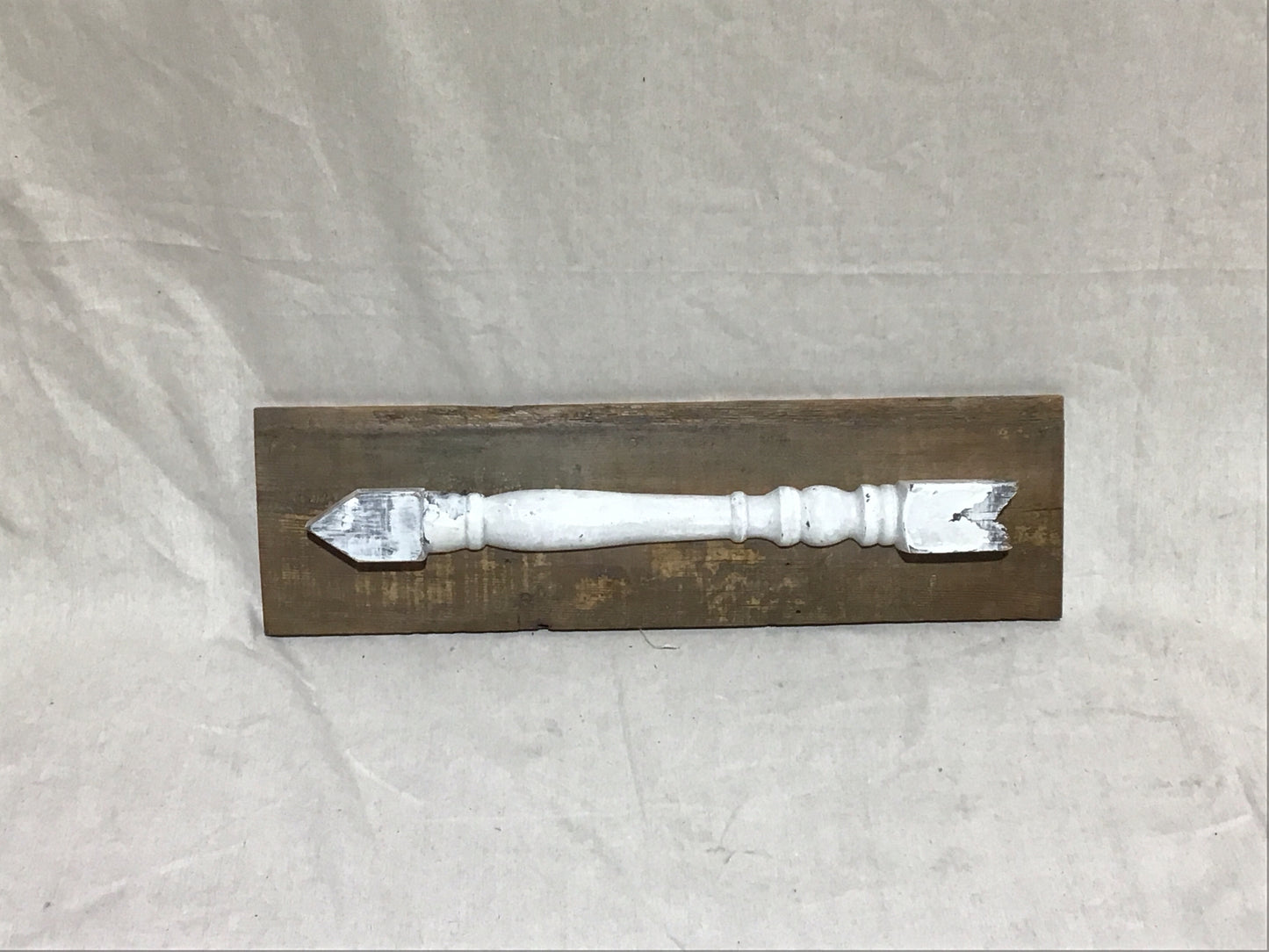 Upcycled spindle arrow wallhanging