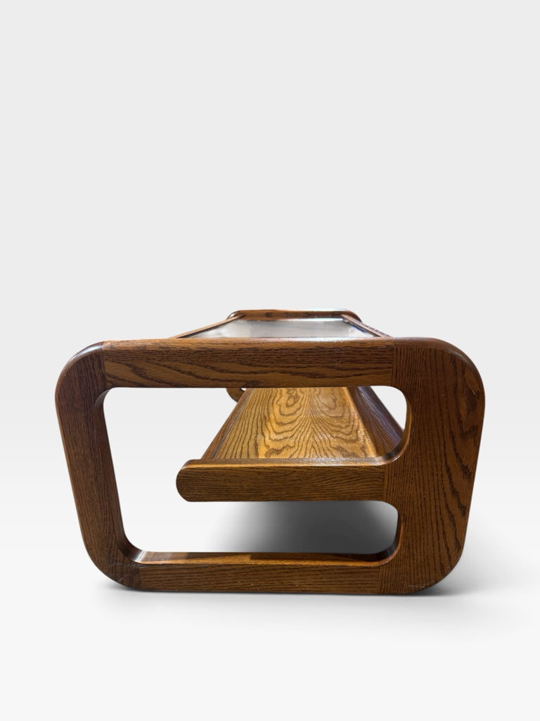 VTG 1970s Modernist coffee table w/sled base, oak/smoked beveled glass