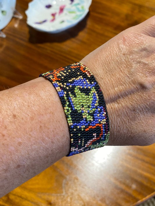 Peyote stitch bracelet, "Lucy", black/green/orange, 1"W x 7"L