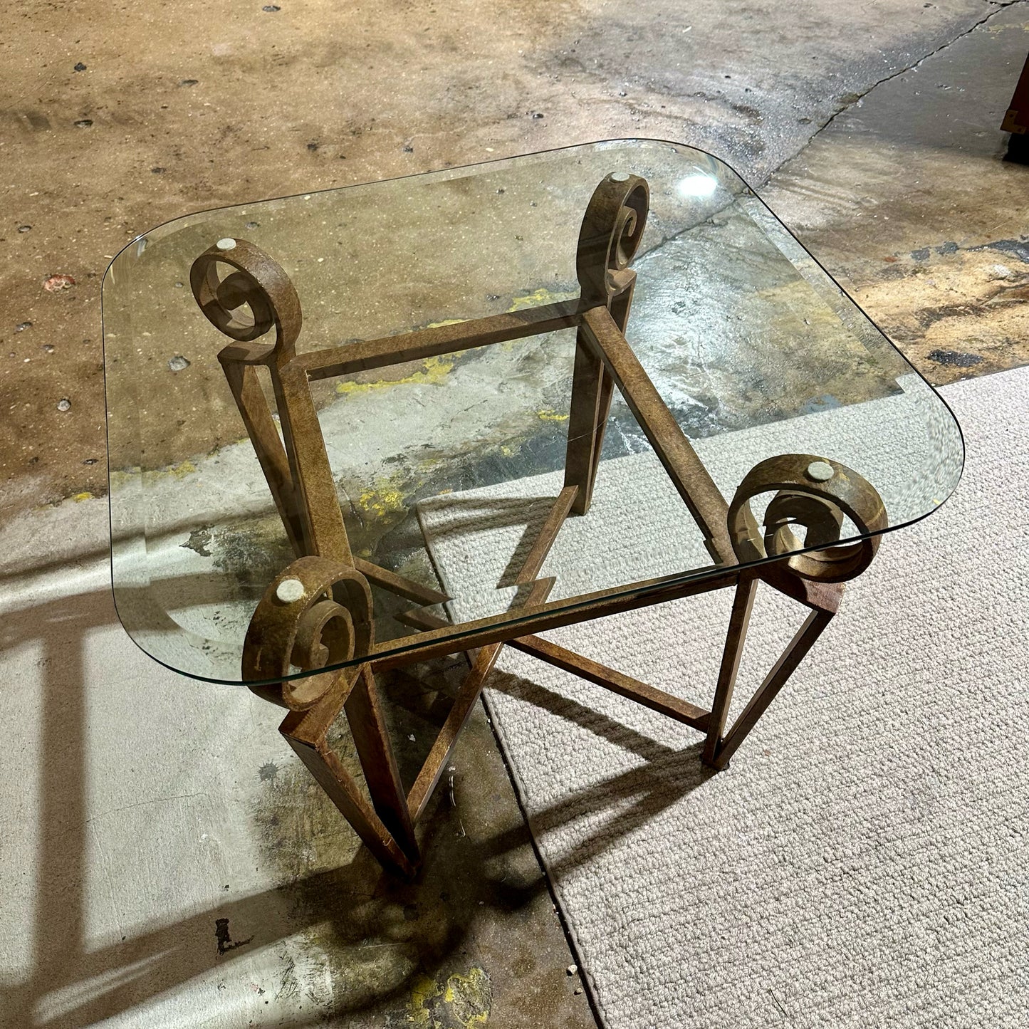 Rounded Edge Glass Top SideTable, Rustic Metal Scroll Base, 28"L x 26"W x 21"H
