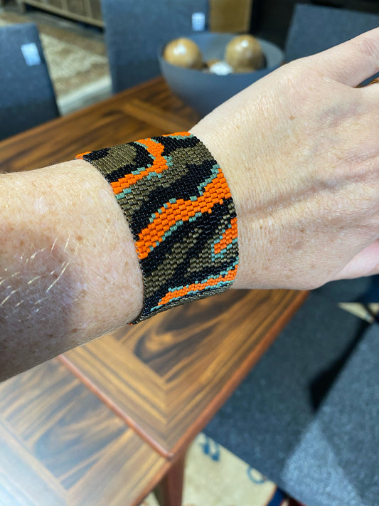 Peyote stitch bracelet, "Waves", black/bronze/orange, 1.5"W x 7"L