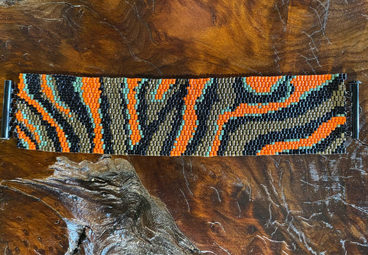 Peyote stitch bracelet, "Waves", black/bronze/orange, 1.5"W x 7"L